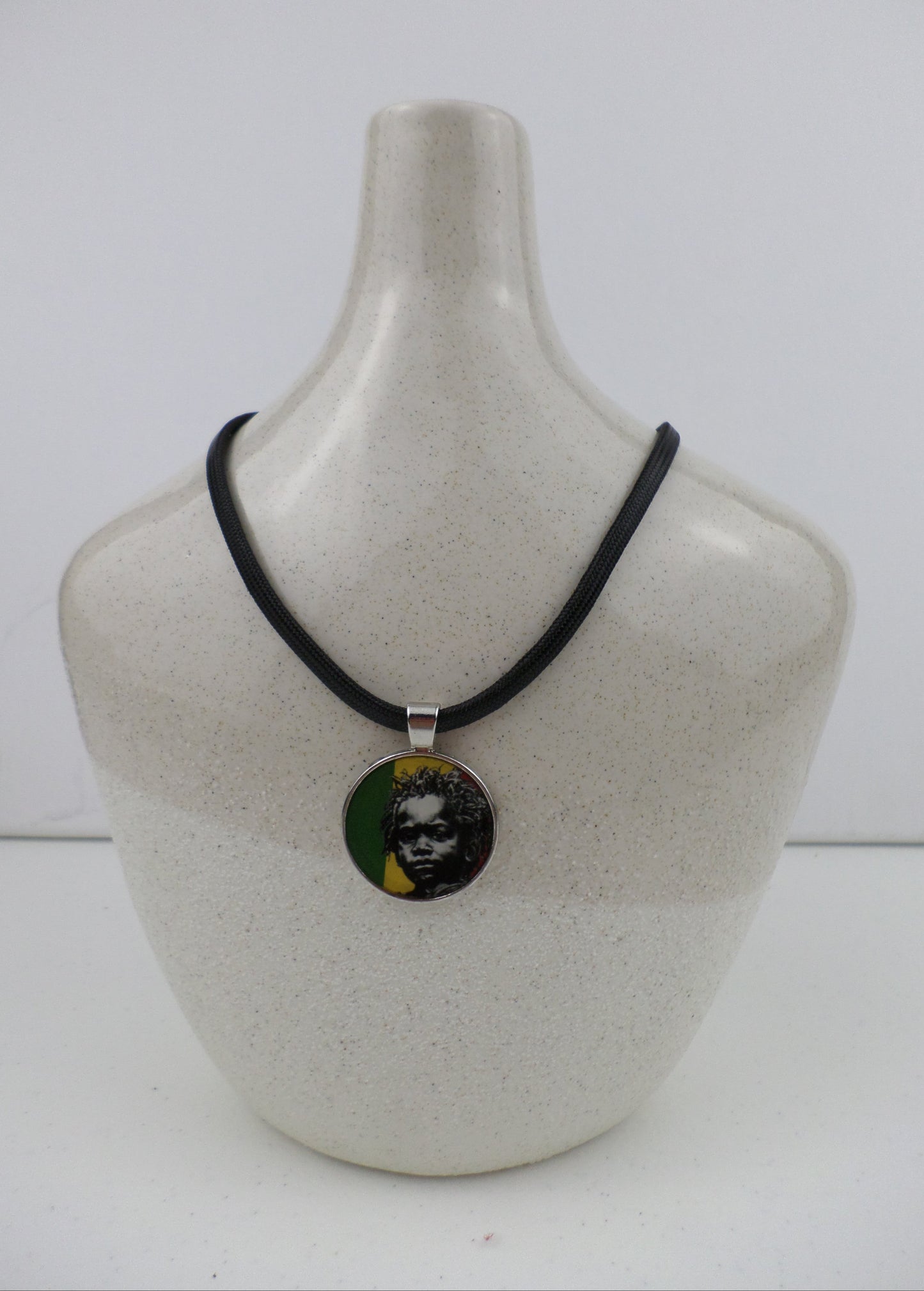 1-10023 *Rastafari Round Pendant and Cord - Rasta Baby